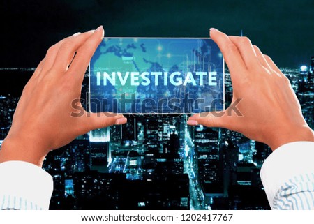 The concept of business, technology, the Internet and the network. Business lady looks at the virtual screen of your smartphone and sees the inscription: Investigate