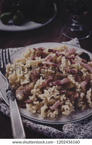 Italian Food Pasta Carbonara With Bacon and Figs Dark Moody Food Photography Stock Images