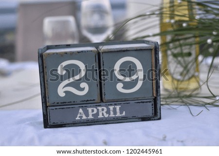 Wood blocks in box with date, day and month 29 April. Wooden blocks calendar