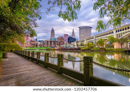 Cleveland, Ohio, USA downtown skyline on the Cuyahoga River at dusk.
