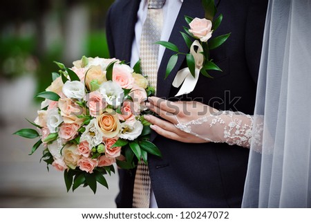 Bride with wedding  bouquet, closeup