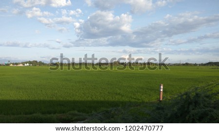 motion pic., agricultural fields, mountain, clouds, clear sky