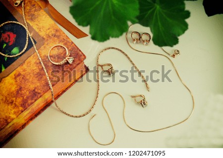 Still life with gold jewelry close-up, advertising concept