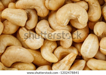Cashew with no shell on a background. Macro nuts, Organic vegan food.