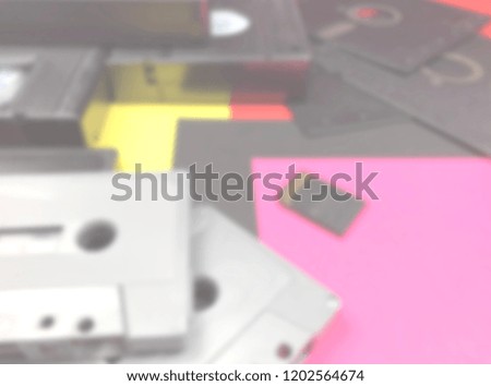 Defocused background of tapes, floppy disk and memory card. Intentionally blurred post production for bokeh effect.