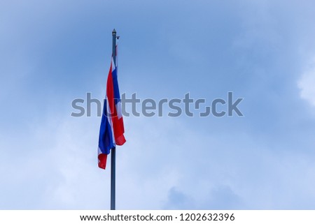 Thai flag on the windless day,  not waving. In economic conditions regression.