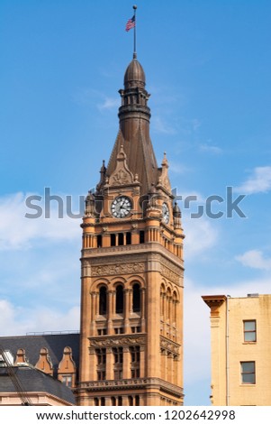 Downtown Milwaukee architecture with blue skies and clouds in the background.  Milwaukee, Wisconsin, USA
