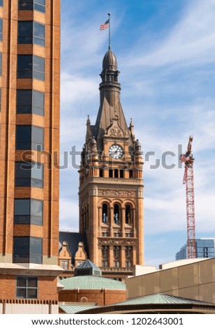 Downtown Milwaukee architecture with blue skies and clouds in the background.  Milwaukee, Wisconsin, USA