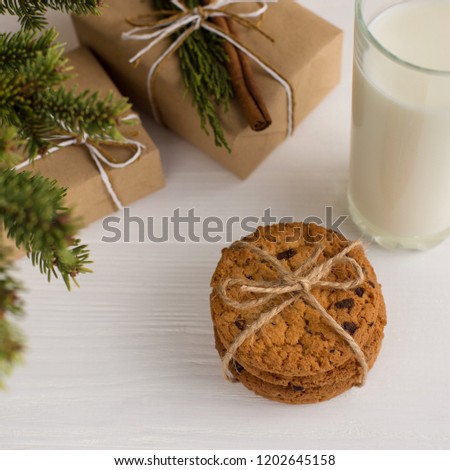 Milk and cookies for Santa Claus under the christmas tree. Concept, copy Space.