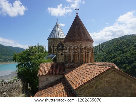 Ananuri Castle Complex View of Two Churches with Crosses River and Blue Sky Background