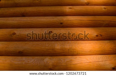 Background of round bars of wooden house wall
