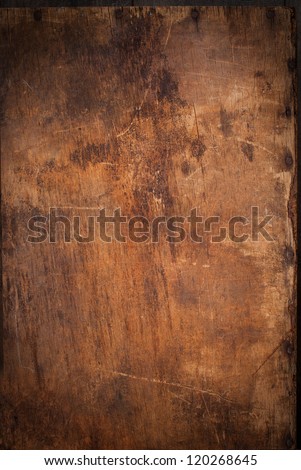 Old Wooden Panel with the Hammered Rusty Nails on the Edge Royalty-Free Stock Photo #120268645