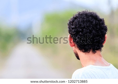 portrait of back looking horizon blurred