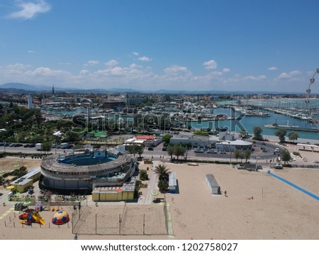 Aerial view of the beach of Rimini (Italy) and its coastal area of the canal port