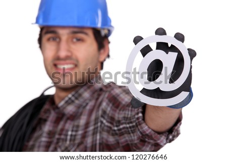 Electrician holding an sign