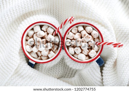 Cappuccino with marshmallows and sweet candy canes