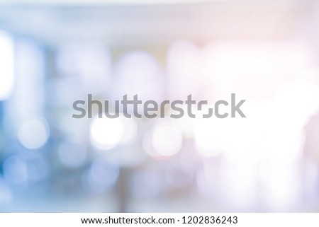 abstract blur contemporary office interior blue background with orange light filter effect 