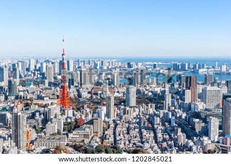 Asia Business concept for real estate and corporate construction - panoramic modern city skyline bird eye aerial view under bright sun and blue sky in Tokyo, Japan
