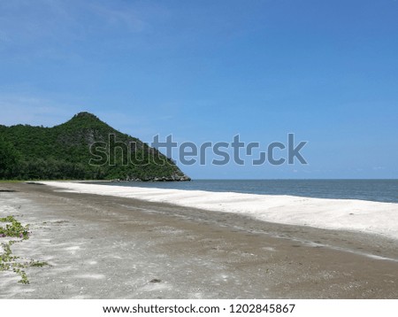 Sam Praya Beach, Sam Roi Yot District, Prachuap Khiri Khan Province, Thailand. Beautiful white sandy beach with mountain and blue sky. Nature background.                               