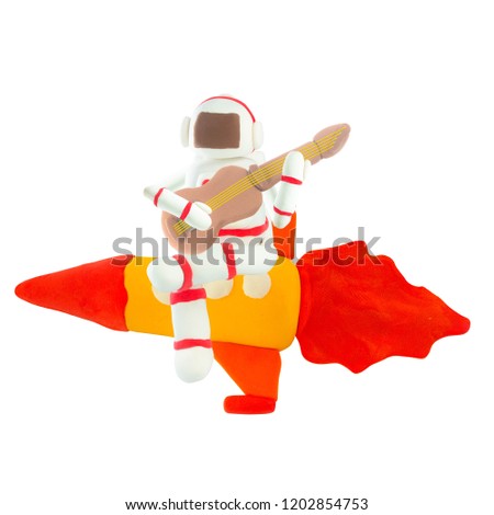 Plasticine Astronaut play guitar on rocket