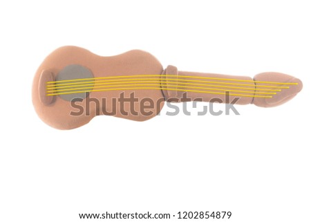 Plasticine brown guitar on white background