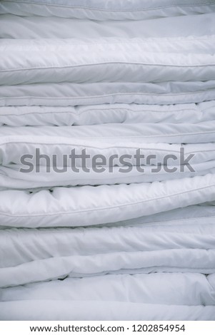 Professional/Minimal close up shot - fabrics and materials for home bedding accessories; cotton, linen, sheets, wool