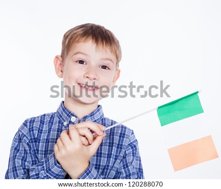 A little boy with Irish flag on the white background