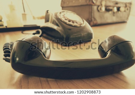Old telephone,Retro,vintage telephone on wooden table