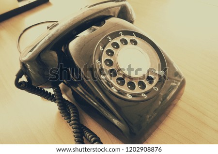 Old telephone,Retro,vintage telephone on wooden table