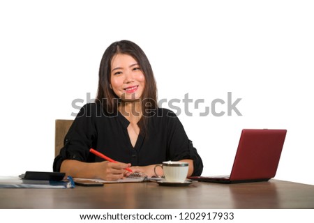 young beautiful and happy successful Asian Chinese business woman working relaxed at office computer desk smiling confident posing corporate in entrepreneur success lifestyle concept