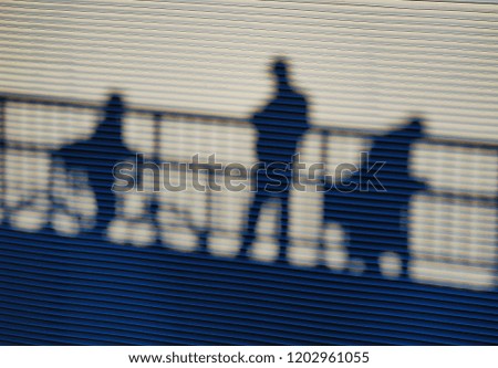 silhouettes on the bridge