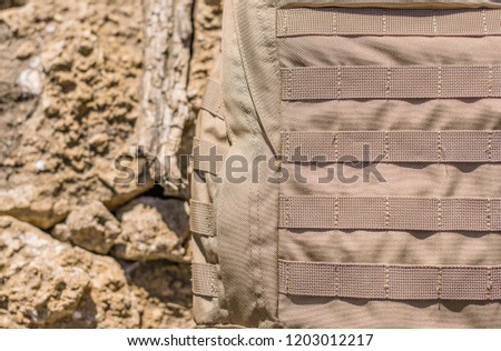 Close up detail of the exterior webbing on a tactical backpack that allows for customization via pouch attachment systems.Tactical backpack color coyote