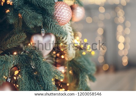 Decorations on a Christmas tree in New Year interior. Christmas and New Year concept