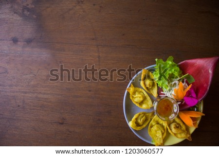 Fried dumplings:food concept.Top view. Free space for your text. On a wooden background.