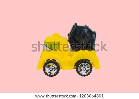 Toy cement concrete truck on pink background