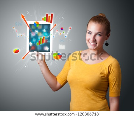 beutiful woman holding modern tablet with colorful diagrams and graphs