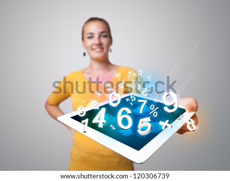 Beautiful young woman holding tablet with numbers