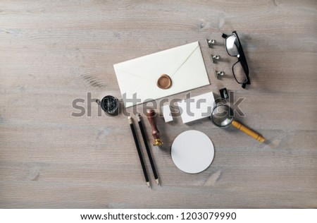 Photo of blank vintage stationery on wooden background. Flat lay.