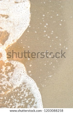 Summer sea, undertow on seashore, directly above on a foam, vertical baclground, copy space 