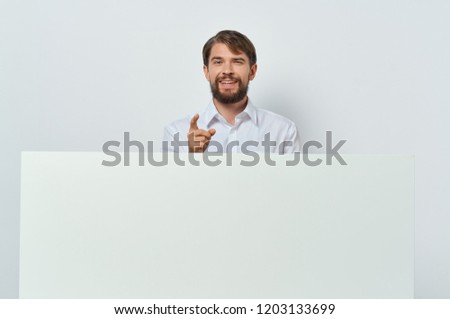 man in shirt and white sheet of paper mockup, poster                          