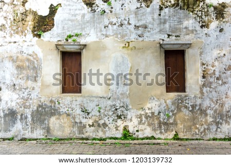 Old brick wall texture with wooden window Traditional Chinese architecture , Shabby building facade with damaged concrete. Copy space