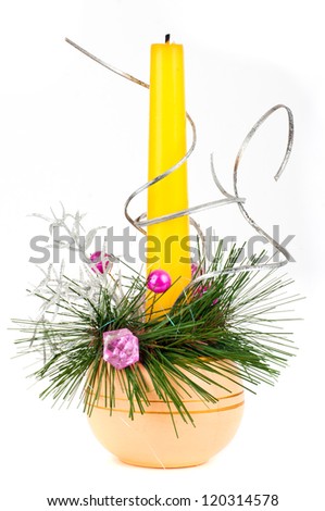 Gold candle with the baubles and cones