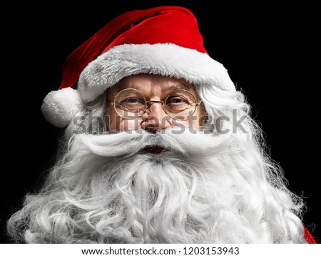 Santa claus's human face on  black background