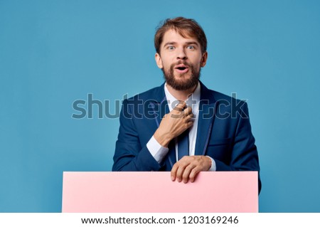 man in a suit and a pink sheet of paper mockup, poster