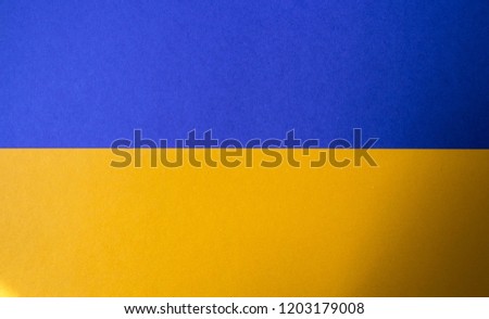 a yellow and blue paper a geometric shapes