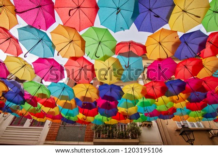 Street decoration with colorful umbrellas.Umbrella Sky Project in Agueda, Portugal.