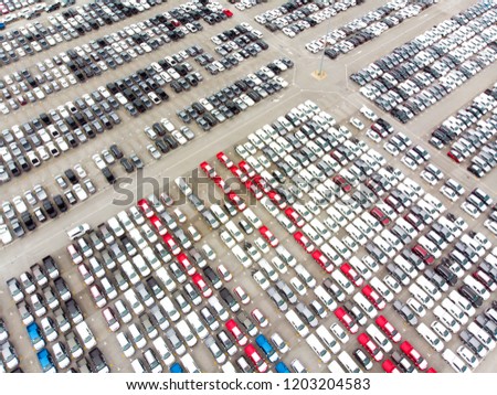 Bird's-eye view photo from flying drone, New Cars produced Several times a year at industrial estate for import export around in the world