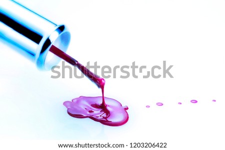 Creative colorful contrast. Nail polish dripping against white background.
