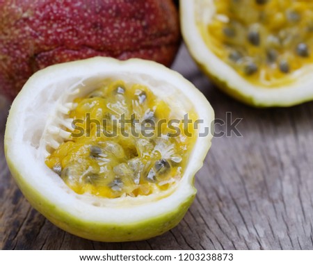 Organic fresh passion fruit on a wooden table.