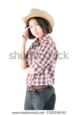 Young pretty woman in a cowboy hat and plaid shirt with arms crossed isolated on white background